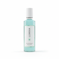 Sleek clear bottle of teeth whitening mouthwash with mint green label on white background